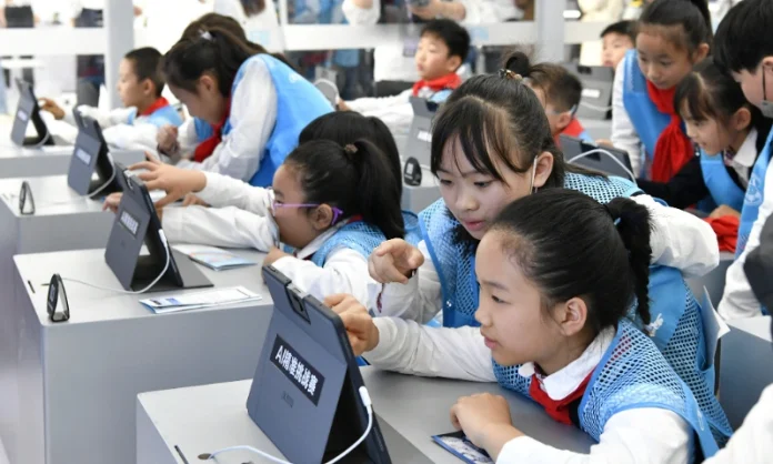 China's Ministry of Education has launched a comprehensive AI literacy plan, making AI curriculum mandatory for around 280 million students from kindergarten through university by 2030.