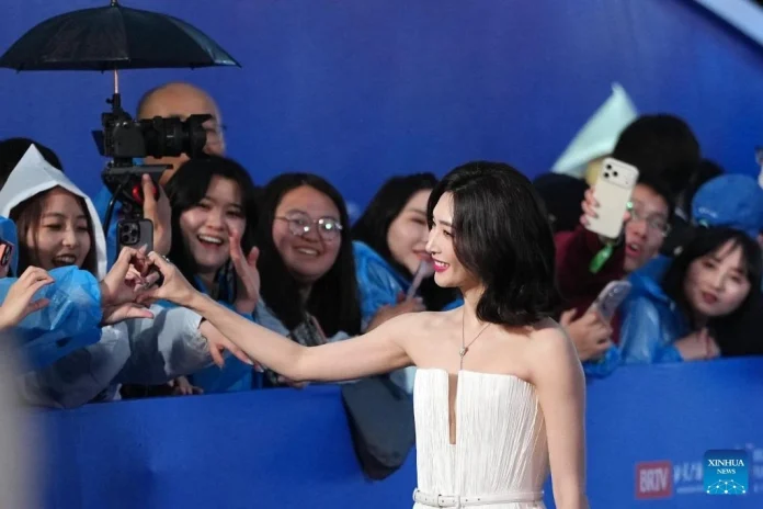The rapid adoption of generative AI in China's film industry is causing widespread job displacement, particularly among extras, editors, and mid-tier actors in production hubs like Hengdian.