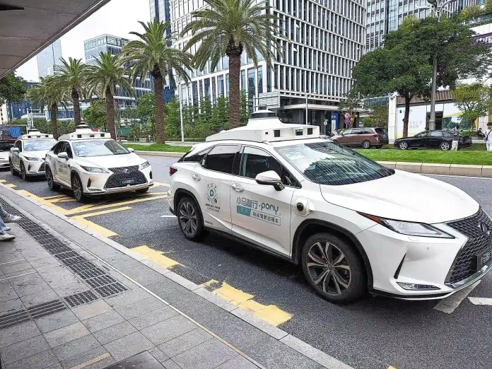 Goldman Sachs projects China's robotaxi fleet will nearly triple to 14,000 by the end of 2026, signaling a commercial inflection point for the autonomous vehicle sector.