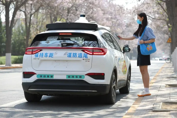 Chinese regulators have suspended the issuance of new robotaxi licenses following a major traffic incident involving Baidu's Apollo Go fleet in Wuhan, sparking a nationwide debate over autonomous vehicle safety.