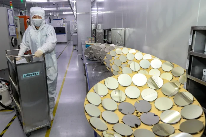 China's semiconductor exports surged 100% year-on-year to a record $31 billion in April 2026, driven by massive domestic investments in legacy chip production and booming AI demand.