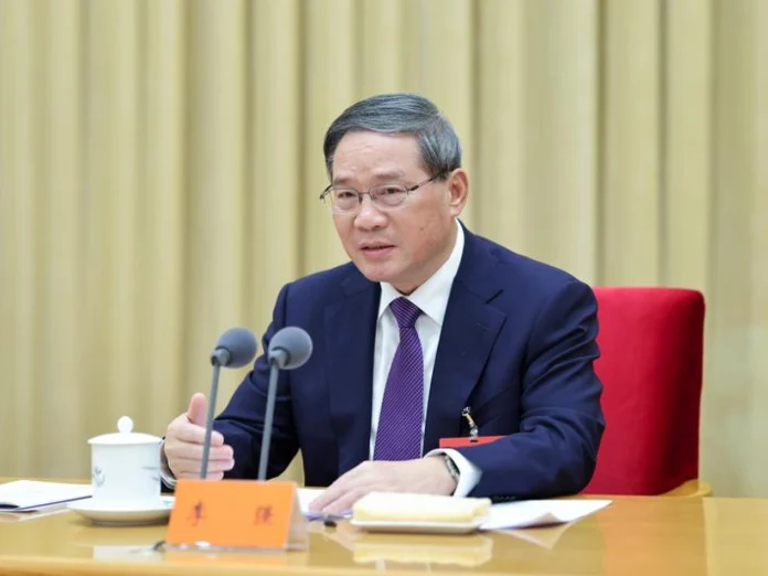 Chinese Premier Li Qiang has called for the accelerated integration of artificial intelligence into advanced manufacturing, emphasizing the technology's critical role in offsetting economic headwinds and driving new industrial growth.