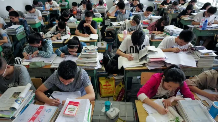 As 12.9 million students sit for China's 2026 gaokao, authorities are deploying real-time AI surveillance to detect cheating and warning against AI-predicted exams.